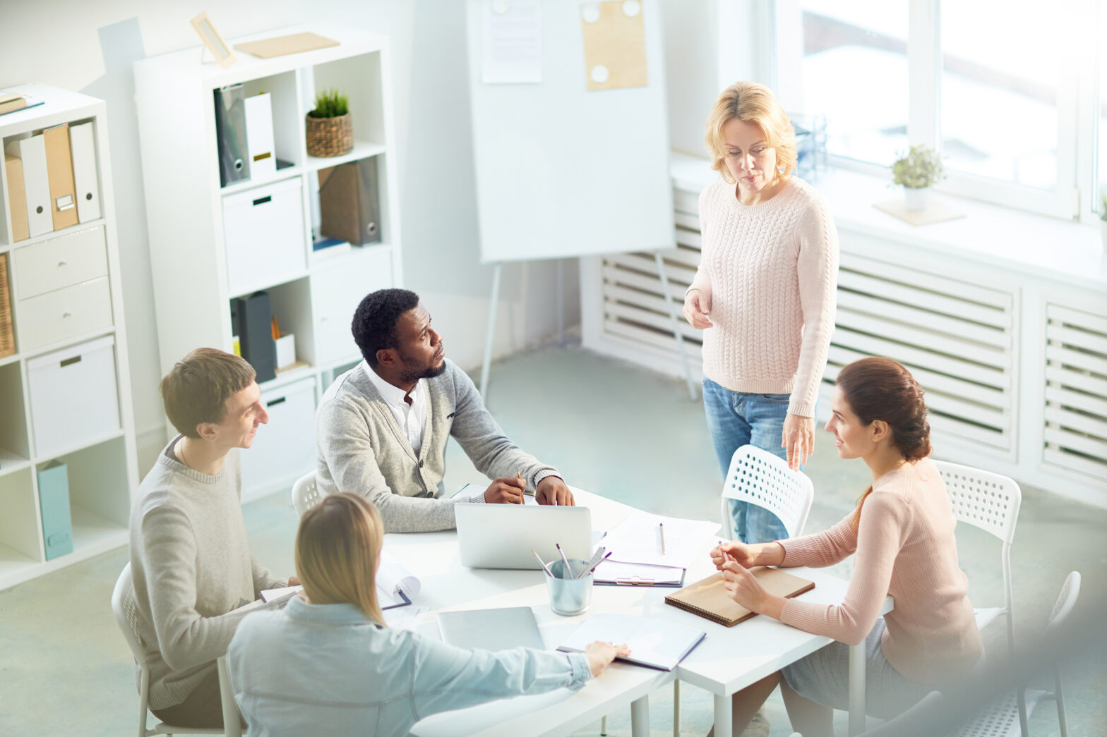 European entrepreneur in a modern office discussing business plans